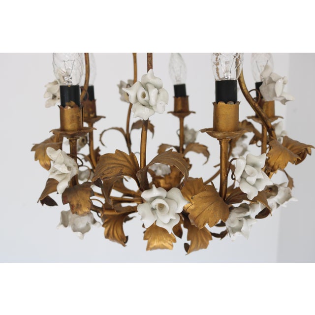 Romantic and timeless Mid-Century Italian tôle chandelier from the 1950s, handcrafted in the Florentine tradition. This...