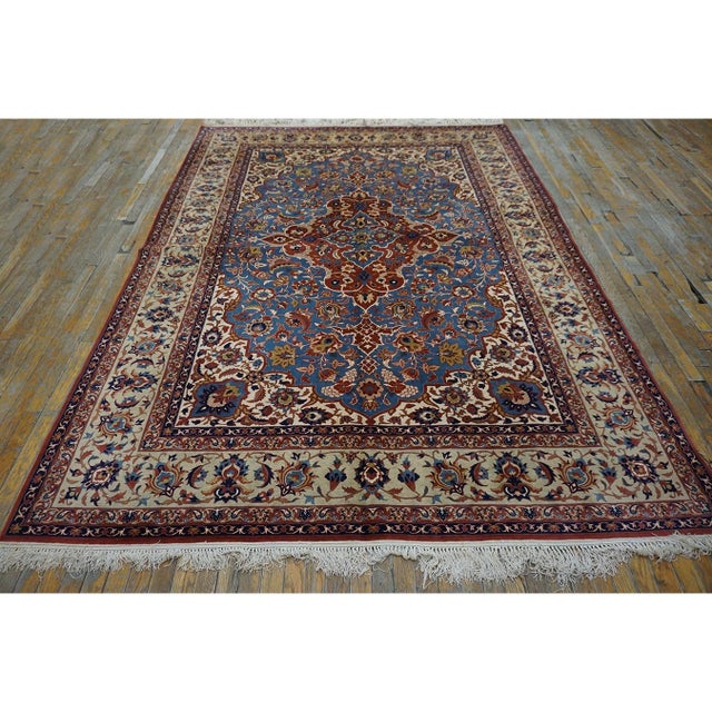 "This exceptional 1940 Mid-20th Century Esfahan carpet is a masterwork of formal weaving artistry. Measuring 6' 9" x 9'...