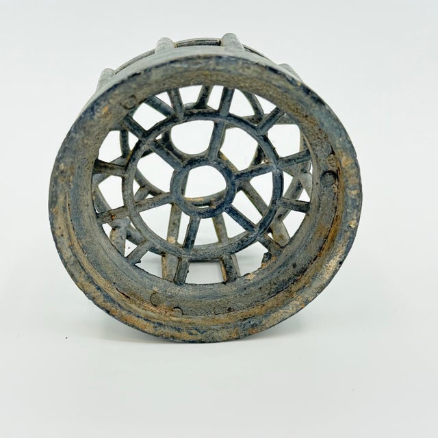 A charming pair of vintage metal flower frogs attributed to Dazey, featuring two distinct cage-style forms that once...