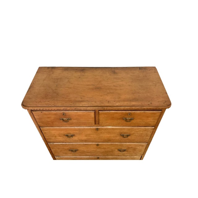 A handsome 19th-century European pine tallboy chest of drawers, distinguished by its unusually tall, architectural...
