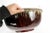 A truly massive pottery bowl with deep red center surmounted with glaze drips below a matte band and trimmed with a green...