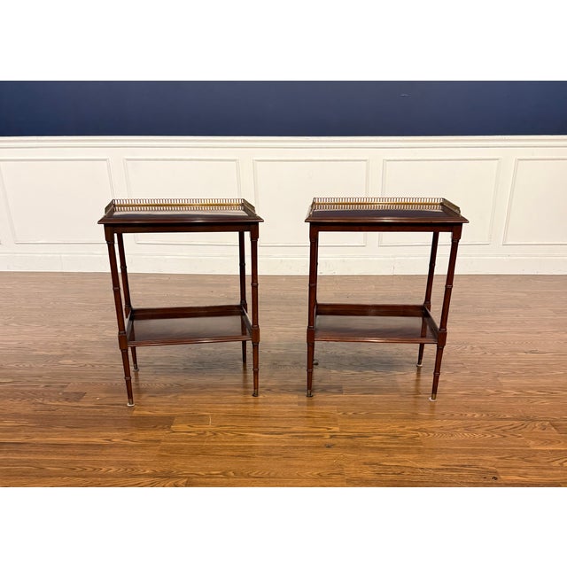 This is a pair of mahogany end tables with brass galleries. They feature aesthetically pleasing swirly crotch mahogany top...