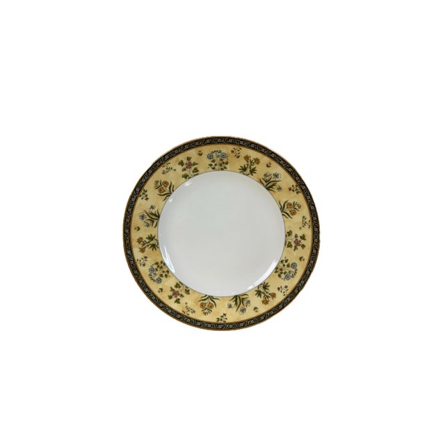 “India” Wedgwood is fine bone‑china featuring a cream‑ivory background with exotic floral sprays outlined in pale saffron,...