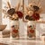 A pair of vintage ceramic beige vases, with a beautiful crackle finish and colorful garden cart and flowers design. Gold...