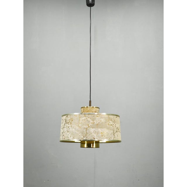 Exceptional pendant lamp designed by Sven Aage Holm Sørensen and produced in Denmark during the 1960s. The lamp features a...