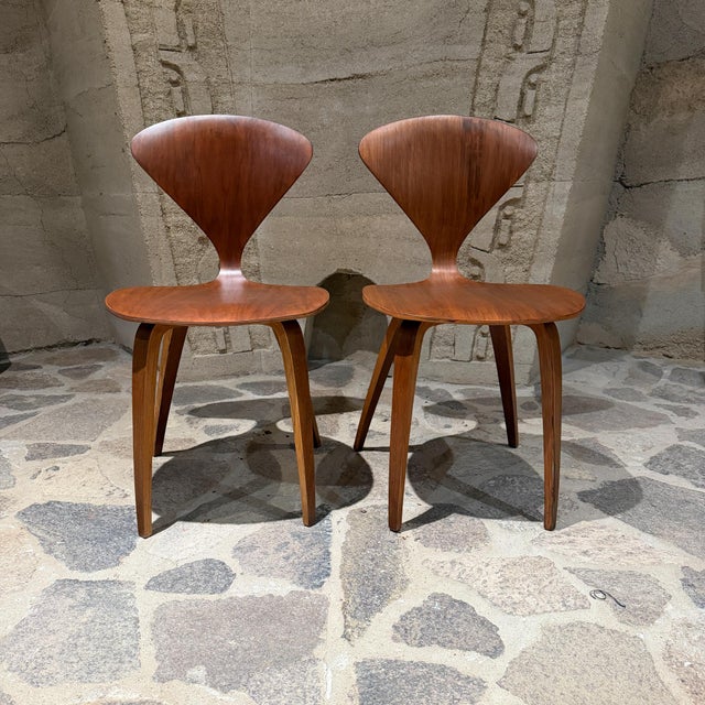 For your consideration, a pair of iconic Cherner Side Chairs, designed by Norman Cherner in 1958. Built using molded,...