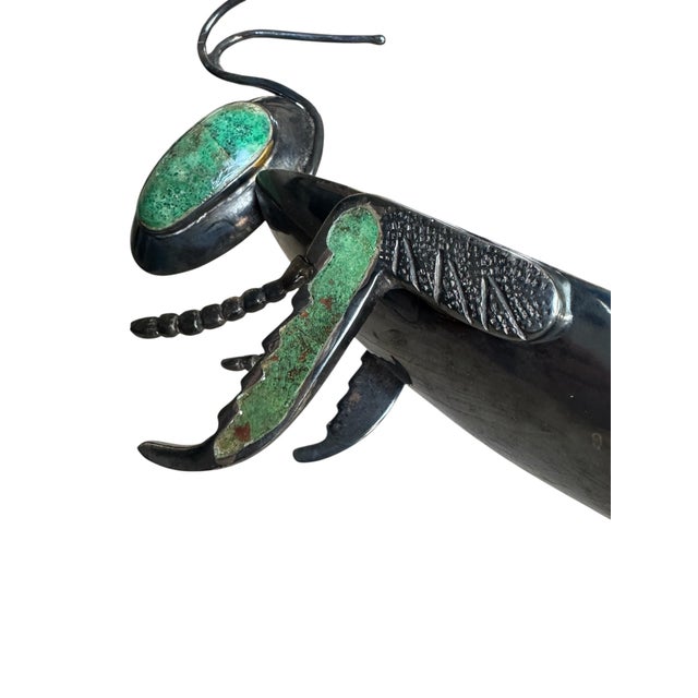 Whimsical yet finely executed silver-plated copper sculpture by Los Castillo, depicting a stylized grasshopper rendered...