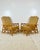 Vintage pair of rattan lounge chairs. Chinese chippendale fretwork designs on sides and front. Cane wrapped joints....