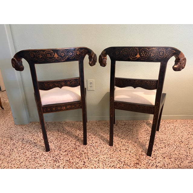 English Late 20th Century Pair of Anglo-Indian Style Ebonized & Gilt Ram's Head Klismos Chairs With Floral Penwork For Sale - Image 3 of 7