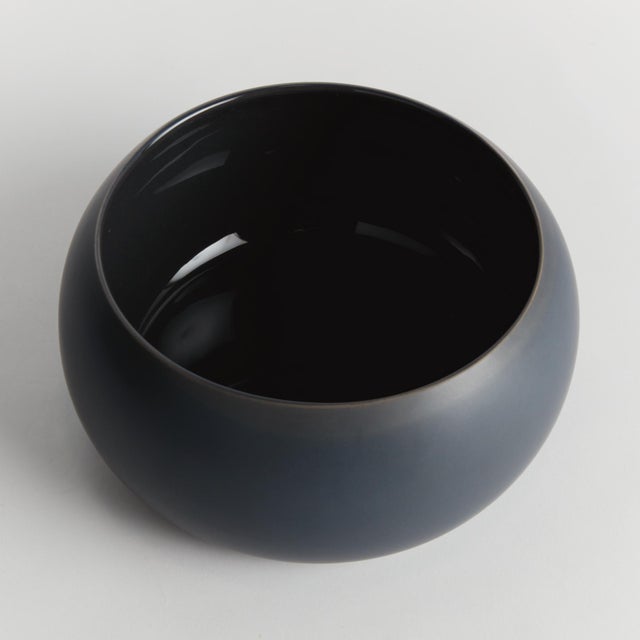 Simple in form with a modern aesthetic, this decorative bowl is the definition of less is more. Finished in a smooth dark...