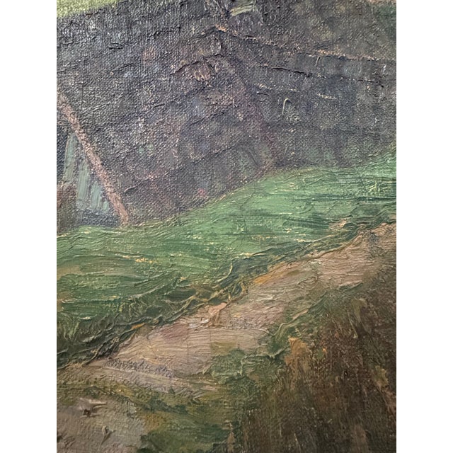 A striking large-scale antique European landscape painting depicting a sweeping pastoral countryside dotted with rustic...