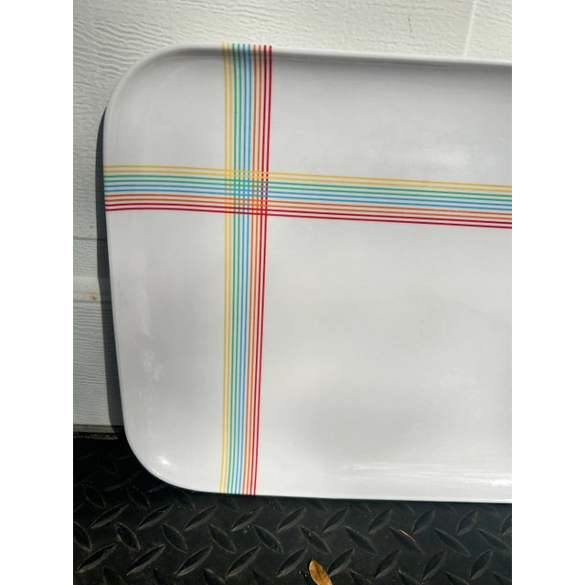 The fun early 90s plastic tray, serving tray with rainbow lines intersecting near one corner. Would make great wall art...