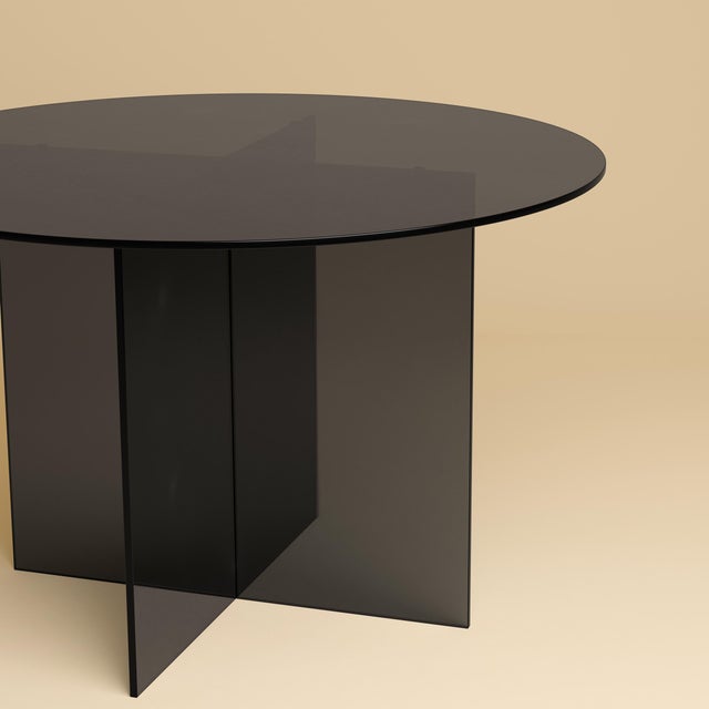 Assembled from Italian glass alone, the Sado is a table scaled for a room and its company that occupies a room without...