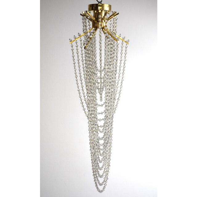 High-quality ceiling lamp, meticulously handcrafted: Hand-cut Swarovski crystal spheres, hand-strung. Gold-plated brass...