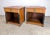 A delightful pair of Neoclassical / French Empire Baker Furniture single-drawer nightstands in two-tone cherry wood,...