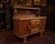 An exceptional and highly unusual english art deco solid oak sideboard dating to the 1930s, retaining its original...