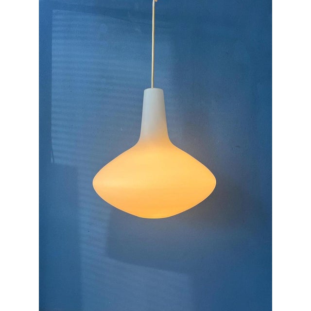 Beautifully shaped 'Bulbo' opaline glass pendant lamp by Lisa Johansson Pape for Stockmann Orno. The piece is made out of...