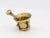 This early 20th-century mortar and pestle is made of brass with an honest patina. Both the mortar and pestle are...