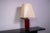 Laquered red sculptural metal tabl;e lamp with oversized lamp shade. European Plug (up to 250V).The wiring of this item...