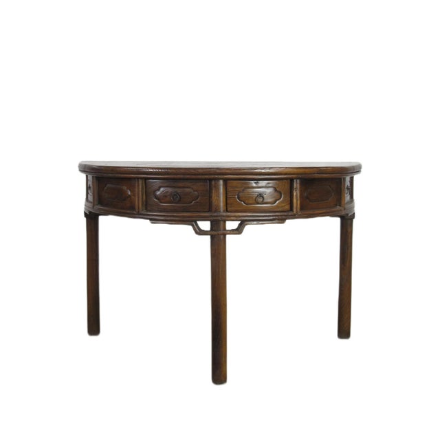 This demi table shows nicely aged wood grain and color with the round straight legs. With 4 drawers, it will be a classy...