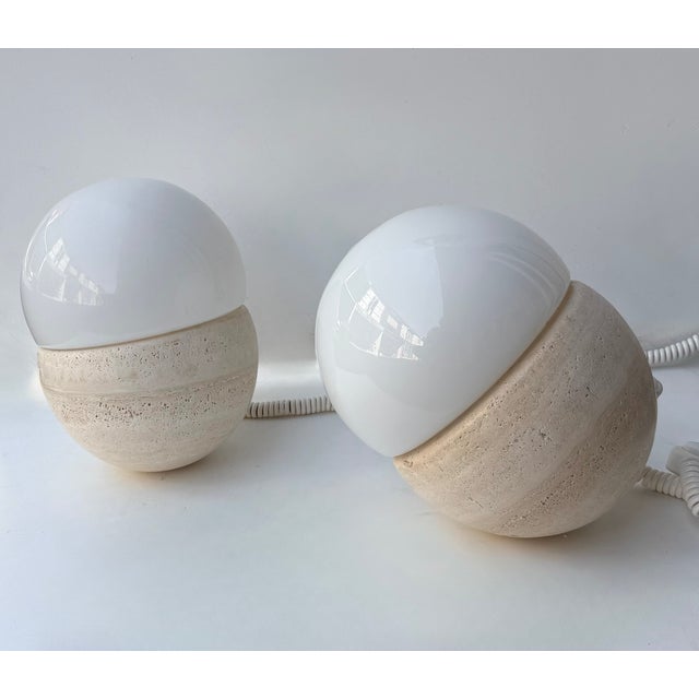 Mid-Century Modern Space Age Pair of abstract sculpture Culbuto table or bedside lamps in travertine and white opaline...