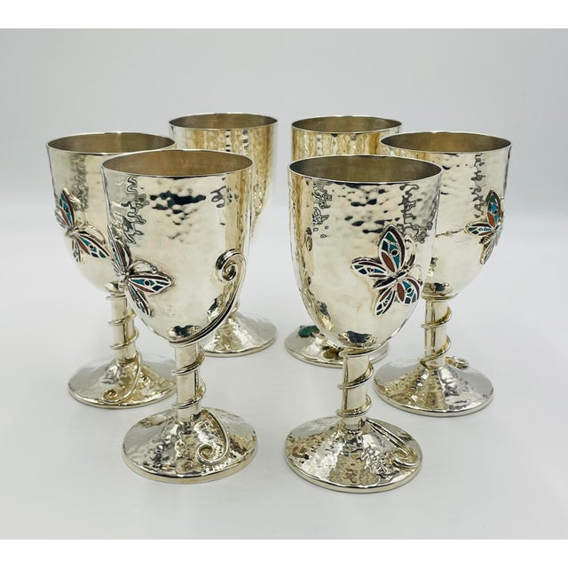 A beautiful and highly collectible set of six silver-plated goblets designed and handcrafted in Taxco, Mexico by renowned...