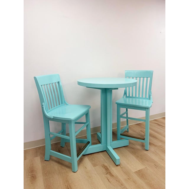 This cheerful turquoise counter-height bistro set is a vibrant and practical outdoor and indoor dining find. The bold...