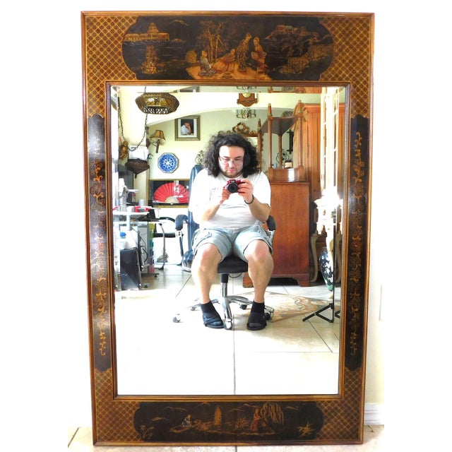 Beautiful large vintage mid-century Chinoiserie black and gold hand painted beveled hanging wall mirror. Black lacquered...