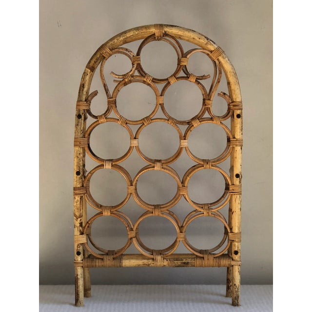 Offering a beautiful mid-century bamboo wine rack with a graceful curved design. Would work well on a side table, kitchen...