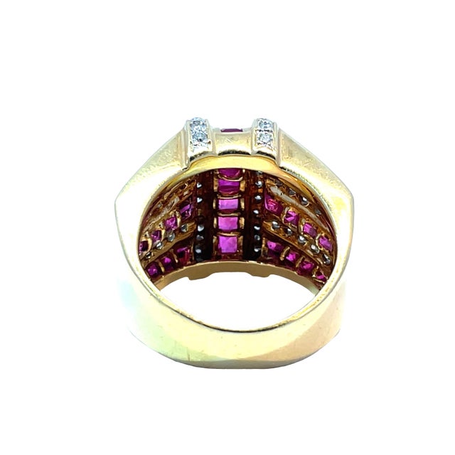 Discover the epitome of elegance with our stunning 18k yellow gold ring, featuring a captivating 4.06-carats rubies at its...