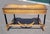 Fabulous French Empire Style 1950s writing desk. Features brass gallery top winged Swan front legs on Leaf fee stretcher...