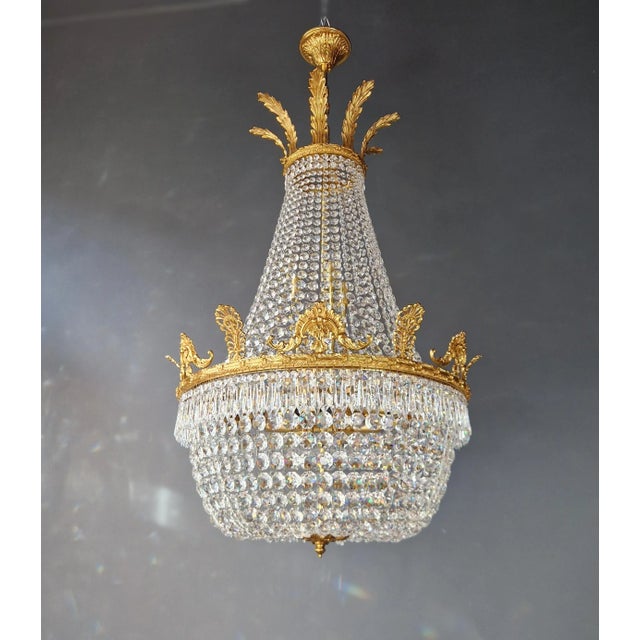 Introducing a stunning Brass Basket Empire Sac a Pearl Chandelier, an exquisite piece adorned with captivating crystals,...
