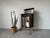 A magnificent 1900's Antique English mahogany and brass framed music cabinet. The cabinet design harmoniously blends...
