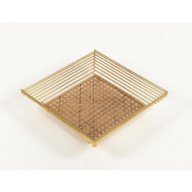 Midcentury beautiful square vide-poche or centerpiece in acrylic glass, brass and ratta in the style of Christian Dior...