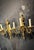 Circa 1900 pair of gilt bronze sconces by Caldwell with ram’s heads atop and flowers on the body. 3 lights sconces, newly...