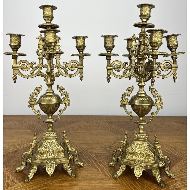 An impressive pair of Vintage French candelabras featuring beautifully ornate detailing and elegant five arm candle...