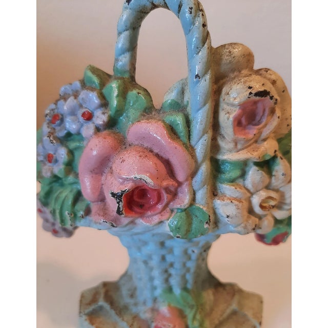 Vibtage Hubley doorstop. Circa 1930s Painted original paint in flower basket mold. John Hubley started his company in...