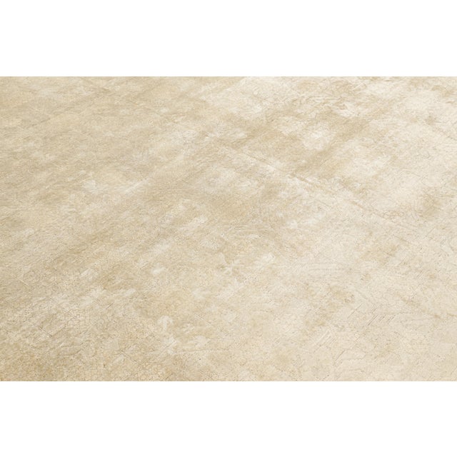 Hand-knotted in silk, this 9x12 modern classics rug, with a high-low texture married to the patterns, is inspired by...
