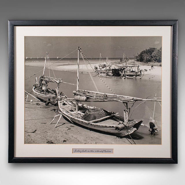 This is a vintage monochrome photograph of fishing boats. An Oriental, framed large format black & white print, dating to...