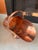 An impressive antique Victorian copper helmet-form coal scuttle, dating to the 19th century, with a graceful sweeping...
