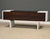 A mid century modern space age sideboard credenza constructed of a molded fiberglass frame and rosewood doors designed by...