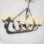 Handsome and unusual cast iron eight light chandelier in the shape of a Viking longboat or ship with a horse head, horse...