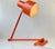 A rare swing arm wall sconce or table lamp in its original orange color. It is called Skala and was designed in 1969 by Jo...