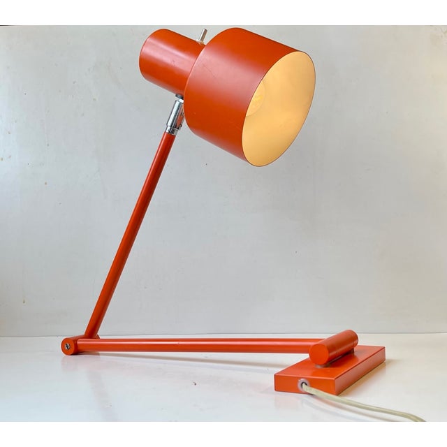 A rare swing arm wall sconce or table lamp in its original orange color. It is called Skala and was designed in 1969 by Jo...