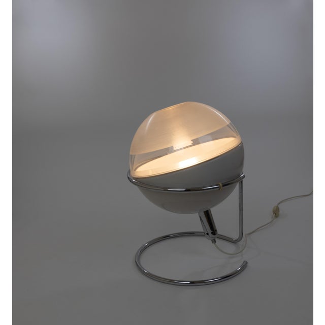 Focus table lamp, designed by Fabio Lenci and manufactured by Design House Guzzini in the 1960s. The lamp consists of a...