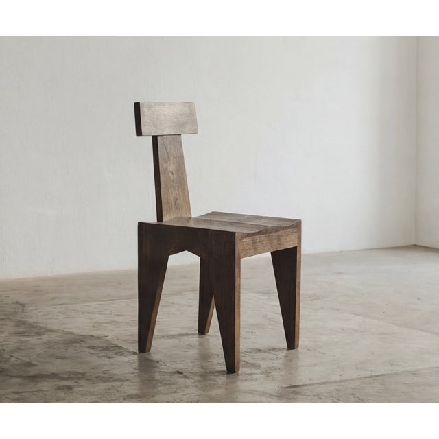 The TChair chair brings two contrasting gestures into dialogue. The seat, shaped with a gouge, retains the direct and...