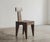 The TChair chair brings two contrasting gestures into dialogue. The seat, shaped with a gouge, retains the direct and...