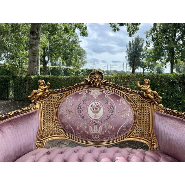 Bring refined French elegance into your interior with this exquisite Louis XVI corbeille settee, crafted circa 1940. With...