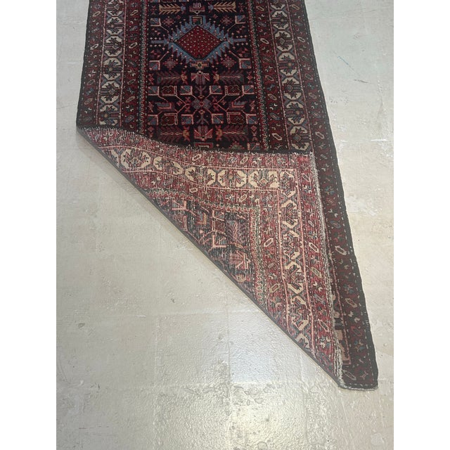 A beautiful vintage Persian runner handwoven in northwest Iran, dating to the mid-20th century (circa 1930s–1950s). This...