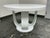 Design Plus Gallery presents a Custom Made Entry Table with Pedestal Base. The table has a white as can be lacquered...